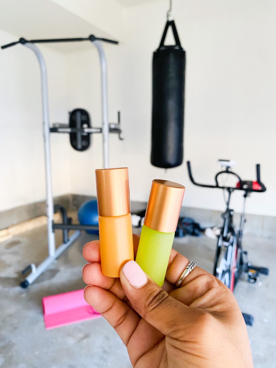 Anjali uses Young Living essential oils in Whimsy + Wellness roller bottles to support herself before, during and after her workout routine